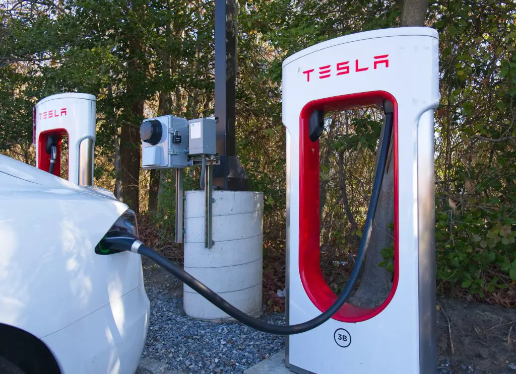 why do tesla owners tap the car before charging